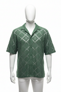 Forest green knit shirt on mannequin
